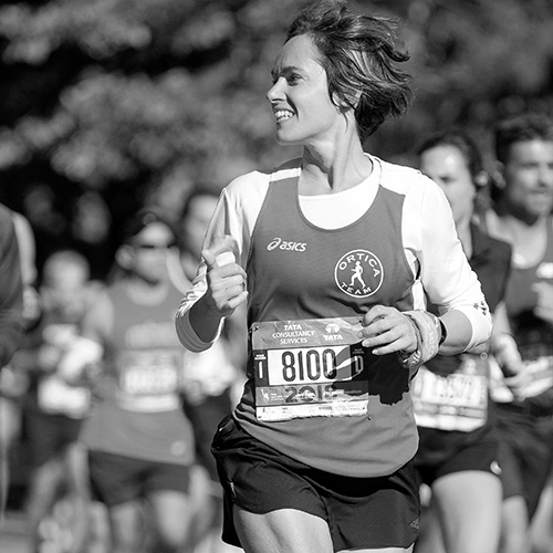 Laura runs a marathon, with her race number on her chest